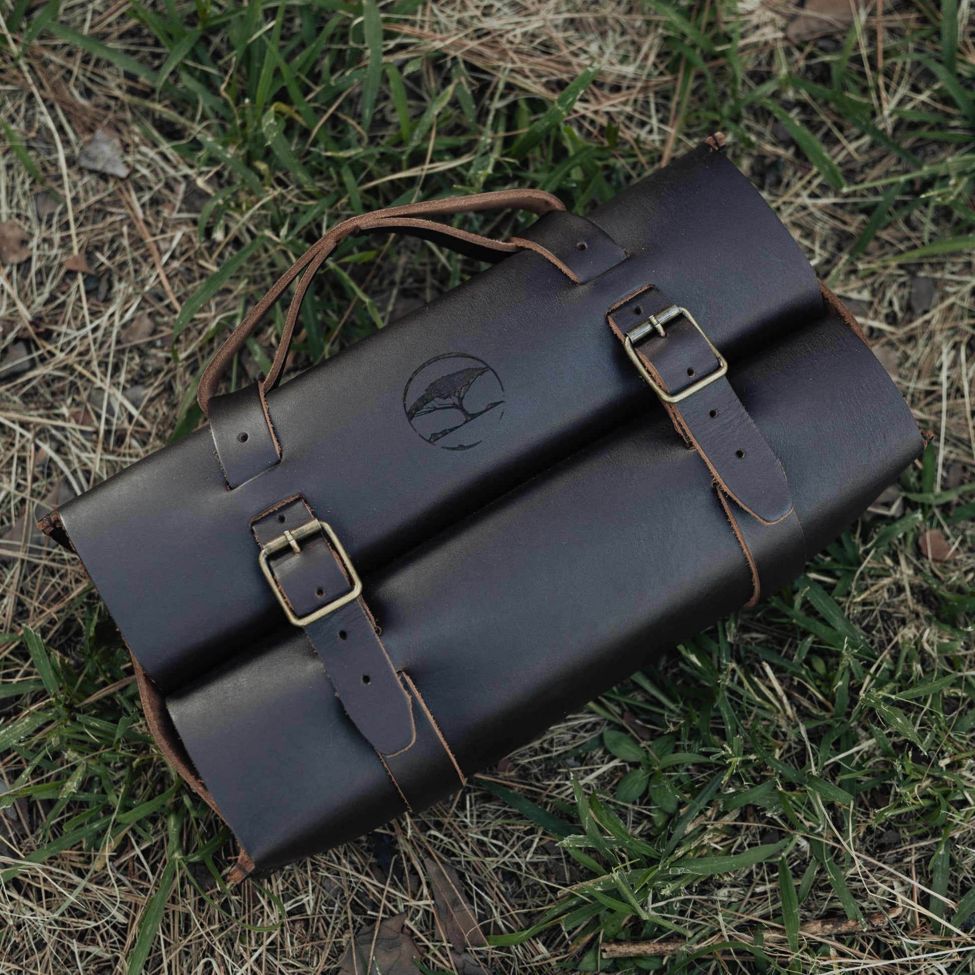 Dark brown leather whiskey bag closed